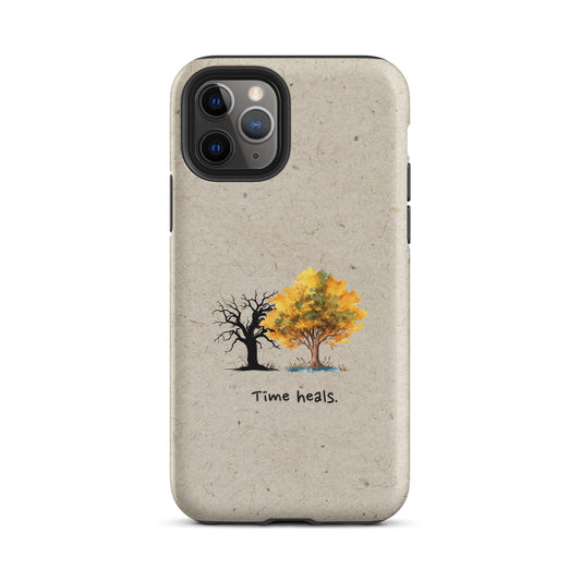 Minimalist Amaannat phone case with “Time Heals” text under evolving tree artwork