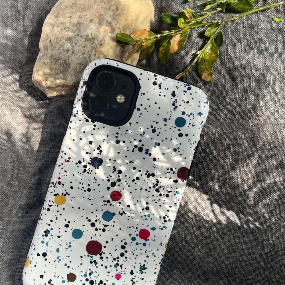 Ink Theory aesthetic phone case for iPhone, featuring a blue botanical ink illustration with flowers and butterflies on a white background, styled with purple flowers